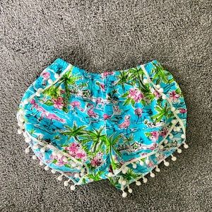 Flamingo Pom-Pom shorts.